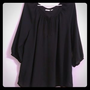 Woman’s black lined blouse